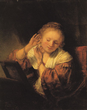 A Young Woman Trying on Earrings 1657 - Rembrandt Van Rijn reproduction oil painting